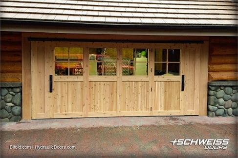 Schweiss designer door clad with wood