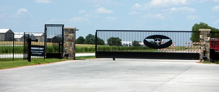 Gated airport leads to aircraft hangar homes