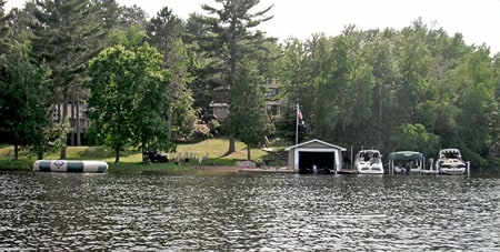 Schweiss Boathouse doors on beautiful lake.