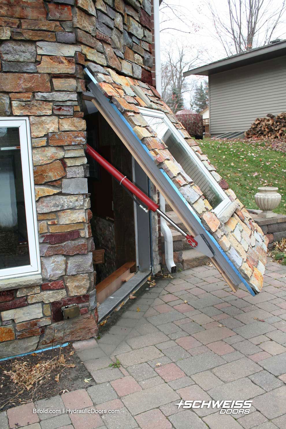 Hydraulic Door has glass window for natural light.