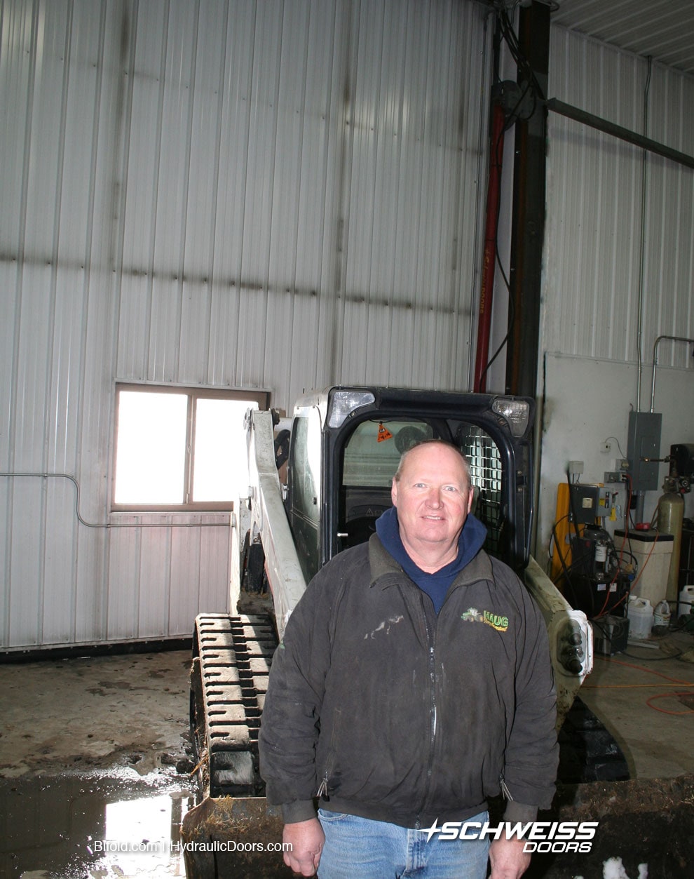 In Winter, bobcat can drive out Schweiss door to remove sno, no hasslew