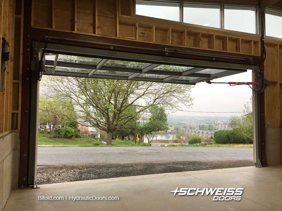 Hydraulic glass garage door